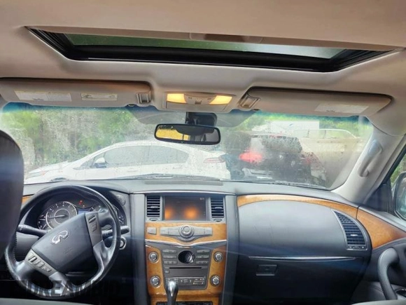 2012 Infiniti QX56 7-passenger with VIN JN8AZ2NE7C9015769, listed as a Copart auction lot 61275105 with 164,342 mi miles and Clean title. Bid and sale history available at DreamBid. Image 9.