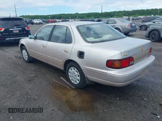 1996 Toyota Camry DX z VIN 4T1BG12K8TU754331, wystawiony jako IAAI lot #42305723 z przebiegiem 152 709 mil mil oraz . Historia ofert i sprzedaży dostępna na DreamBid. Obrazek 3.