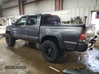 2014 Toyota Tacoma with VIN 5TFLU4ENXEX089927, listed as a Copart auction lot 52140565 with 112,924 mi miles and Salvage Title. Bid and sale history available at DreamBid. Image 2.