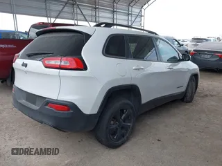 2016 Jeep Cherokee Latitude with VIN 1C4PJLCB5GW207159, listed as a IAAI auction lot 41232649 with 103,991 mi miles. Bid and sale history available at carsss.com. Image 4.