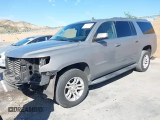 2017 Chevrolet Suburban LS with VIN 1GNSCGEC9HR355405, listed as a IAAI auction lot 41674594 with 170,312 mi miles and . Bid and sale history available at DreamBid. Image 2.