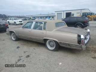 1990 Cadillac Brougham z VIN 1G6DW54Y1LR710024, wystawiony jako Copart lot #88406975 z przebiegiem 183 170 mil mil oraz Tytuł czysty. Historia ofert i sprzedaży dostępna na DreamBid. Obrazek 2.