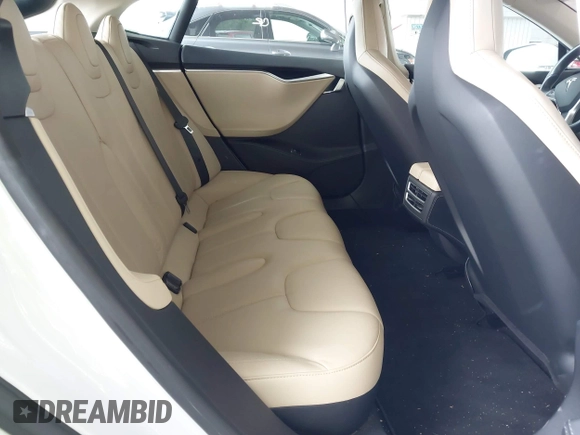 2014 Tesla Model S 60 with VIN 5YJSA1S16EFP53350, listed as a IAAI auction lot 42239753 with 104,985 mi miles and . Bid and sale history available at DreamBid. Image 8.