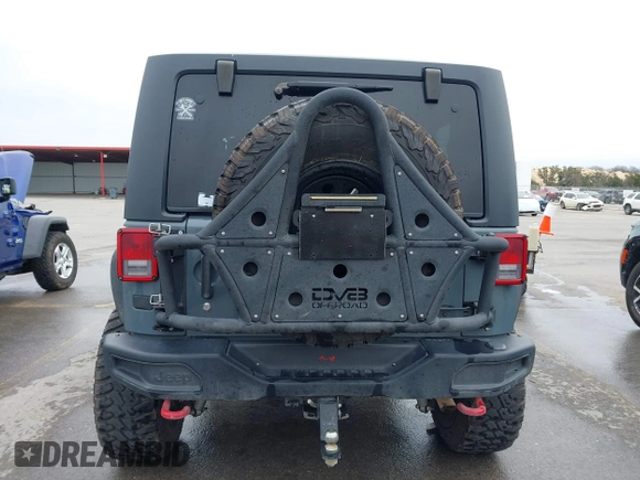 2013 Jeep Wrangler Rubicon 10th Anniversary with VIN 1C4BJWCG2DL651815, listed as a IAAI auction lot 41643919 with 98,297 mi miles and . Bid and sale history available at DreamBid. Image 16.
