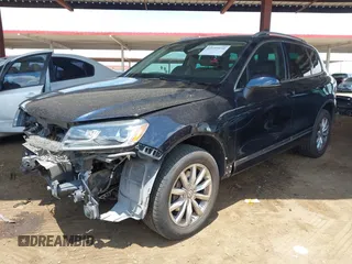 2016 Volkswagen Touareg Sport with VIN WVGEF9BP0GD012148, listed as a IAAI auction lot 42195030 with 95,984 mi miles and . Bid and sale history available at DreamBid. Image 2.