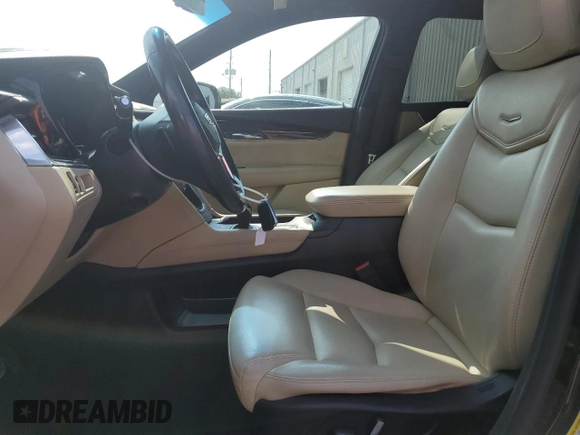 2017 Cadillac XT5 FWD with VIN 1GYKNARS0HZ283618, listed as a Copart auction lot 61640005 with 113,823 mi miles and Salvage title. Bid and sale history available at DreamBid. Image 7.