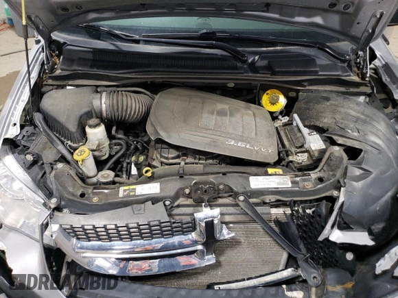 2017 Dodge Grand Caravan SE z VIN 2C4RDGBG7HR822519, wystawiony jako Copart lot #59935725 z przebiegiem 94 050 mil mil oraz Szkoda całkowita • Salvage title. Historia ofert i sprzedaży dostępna na DreamBid. Obrazek 12.
