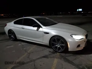 2017 BMW M6 z VIN WBS6J9C56HD934812, wystawiony jako Copart lot #44018915 z przebiegiem 84 409 mil mil oraz Szkoda całkowita • Salvage title. Historia ofert i sprzedaży dostępna na DreamBid. Obrazek 4.