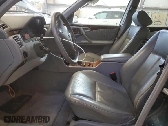 2000 Mercedes-Benz E-Class AWD with VIN WDBJF82G4YX027683, listed as a Copart auction lot 77146524 with 228,654 mi miles and Clean Title. Bid and sale history available at carsss.com. Image 7.