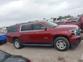 2020 Chevrolet Suburban LT z VIN 1GNSCHKC9LR233596, wystawiony jako IAAI lot #41943325 z przebiegiem 97 515 mil mil oraz . Historia ofert i sprzedaży dostępna na DreamBid. Obrazek 13.