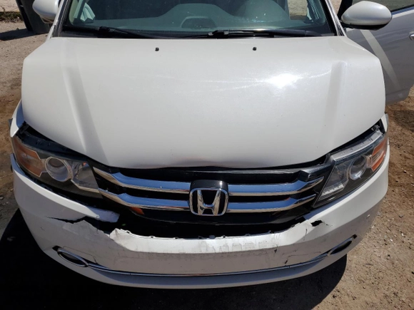 2015 Honda Odyssey Touring Elite z VIN 5FNRL5H91FB053430, wystawiony jako Copart lot #55276315 z przebiegiem 96 667 mil mil oraz Szkoda całkowita • Salvage title. Historia ofert i sprzedaży dostępna na DreamBid. Obrazek 11.