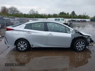 2021 Toyota Prius LE with VIN JTDKAMFP9M3170928, listed as a IAAI auction lot 42123934 with 58,293 mi miles and . Bid and sale history available at DreamBid. Image 14.