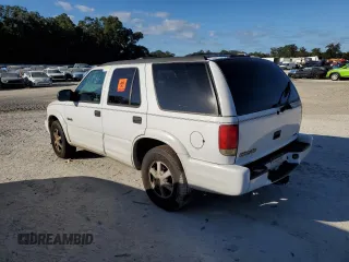 1999 Oldsmobile Bravada z VIN 1GHDT13W1X2704151, wystawiony jako Copart lot #76802764 z przebiegiem 155 630 mil mil oraz Szkody całkowita. Historia ofert i sprzedaży dostępna na DreamBid. Obrazek 2.