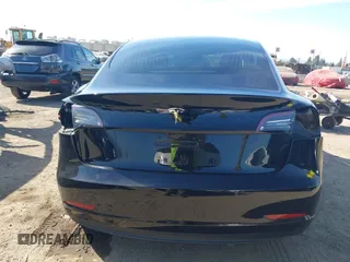 2018 Tesla Model 3 Long Range Battery with VIN 5YJ3E1EA0JF056979, listed as a IAAI auction lot 41865849 with 97,319 mi miles. Bid and sale history available at carsss.com. Image 16.
