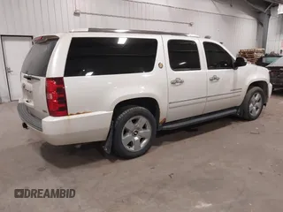 2010 Chevrolet Suburban LTZ with VIN 1GNUKKE31AR290571, listed as a IAAI auction lot 40948006 with 163,758 mi miles. Bid and sale history available at carsss.com. Image 4.