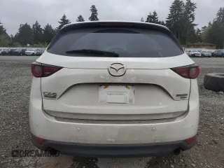 2021 Mazda CX-5 Signature with VIN JM3KFBEY3M0410998, listed as a Copart auction lot 54868885 with 73,207 mi miles and Salvage Title. Bid and sale history available at carsss.com. Image 6.