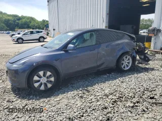 2023 Tesla Model Y Long Range z VIN 7SAYGDEE7PF667947, wystawiony jako Copart lot #56740855 z przebiegiem 21 873 mil mil oraz Szkoda całkowita • Salvage title. Historia ofert i sprzedaży dostępna na DreamBid. Obrazek 1.