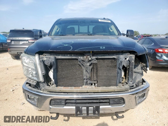 2016 Nissan Titan Platinum Reserve with VIN 1N6BA1F42GN506140, listed as a Copart auction lot 57171395 with 141,295 mi miles and Salvage title. Bid and sale history available at DreamBid. Image 5.