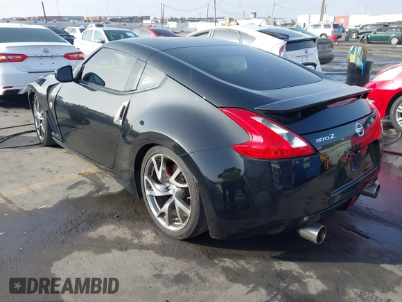 2014 Nissan 370Z Touring with VIN JN1AZ4EH1EM631097, listed as a IAAI auction lot 41230197 with 85,304 mi miles. Bid and sale history available at carsss.com. Image 3.