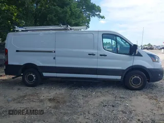 2023 Ford Transit Cargo z VIN 1FTYE1Y82PKA83403, wystawiony jako IAAI lot #42621450 z przebiegiem 44 617 mil mil oraz . Historia ofert i sprzedaży dostępna na DreamBid. Obrazek 13.