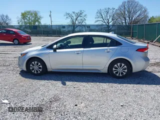 2021 Toyota Corolla Hybrid LE with VIN JTDEAMDE5MJ022110, listed as a IAAI auction lot 41912920 with 59,198 mi miles. Bid and sale history available at carsss.com. Image 14.