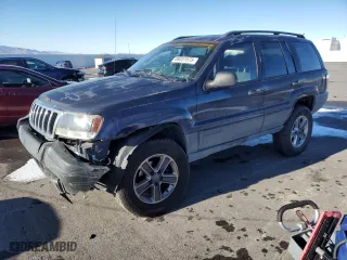 2004 Jeep Grand Cherokee Laredo with VIN 1J4GW48S44C325808, listed as a Copart auction lot 89351575 with 312,011 mi miles and Salvage Title. Bid and sale history available at carsss.com. Image 1.