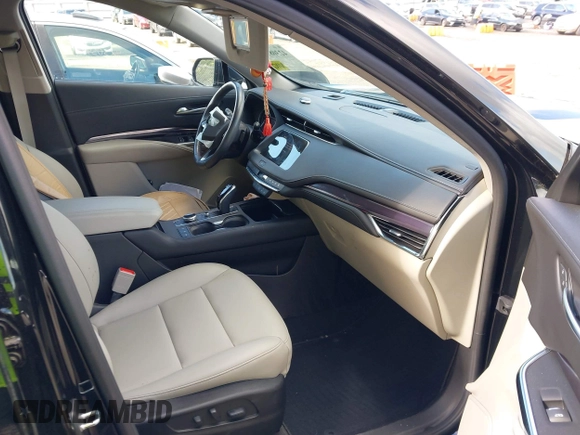 2022 Cadillac XT4 FWD Luxury with VIN 1GYAZAR48NF162799, listed as a IAAI auction lot 42308957 with 19,863 mi miles and . Bid and sale history available at DreamBid. Image 5.