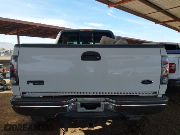 1999 Ford F-150 XL with VIN 2FTRX18L9XCA21004, listed as a IAAI auction lot 41616300 with 186,620 mi miles. Bid and sale history available at carsss.com. Image 16.