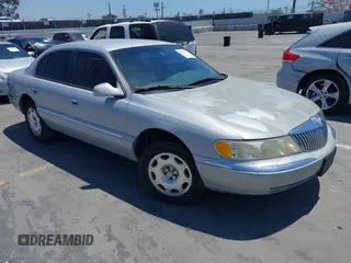 2001 Lincoln Continental z VIN 1LNHM97VX1Y691923, wystawiony jako IAAI lot #42232775 z przebiegiem 193 263 mil mil oraz . Historia ofert i sprzedaży dostępna na DreamBid. Obrazek 1.