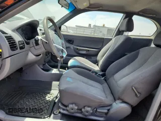 2003 Hyundai Accent GL z VIN KMHCG35C33U258812, wystawiony jako Copart lot #57509245 z przebiegiem 153 716 mil mil oraz Szkoda całkowita • Salvage title. Historia ofert i sprzedaży dostępna na DreamBid. Obrazek 7.