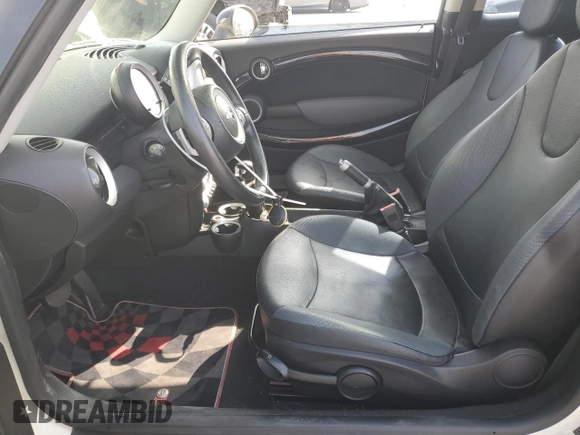 2007 MINI Hardtop with VIN WMWMF33547TT51590, listed as a Copart auction lot 57323995 with 114,113 mi miles and Salvage title. Bid and sale history available at DreamBid. Image 7.