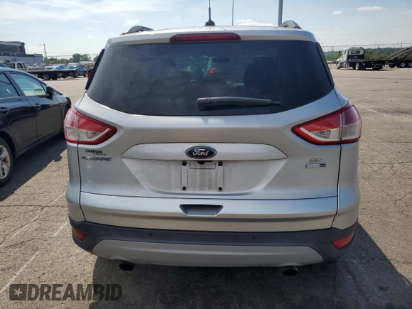 2014 Ford Escape SE with VIN 1FMCU9GX3EUB19987, listed as a Copart auction lot 64042695 with 96,775 mi miles and Salvage title. Bid and sale history available at DreamBid. Image 6.
