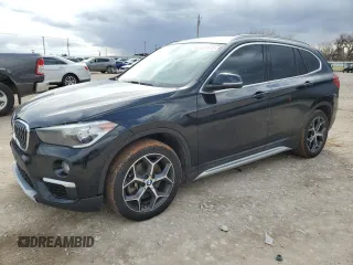 2018 BMW X1 xDrive28i with VIN WBXHT3C32J5L28030, listed as a Copart auction lot 47087415 with 100,708 mi miles and Salvage Title. Bid and sale history available at carsss.com. Image 1.