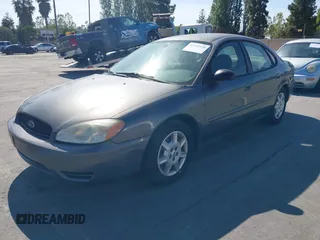 2005 Ford Taurus SE with VIN 1FAFP53U95A289971, listed as a IAAI auction lot 42143134 with 167,702 mi miles. Bid and sale history available at carsss.com. Image 2.
