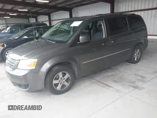 2010 Dodge Grand Caravan SXT z VIN 2D4RN5D11AR220105, wystawiony jako IAAI lot #42299610 z przebiegiem 223 842 mil mil oraz . Historia ofert i sprzedaży dostępna na DreamBid. Obrazek 2.
