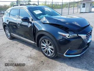 2021 Mazda CX-9 Signature with VIN JM3TCBEY1M0539786, listed as a IAAI auction lot 42264611 with 51,168 mi miles and . Bid and sale history available at DreamBid. Image 1.