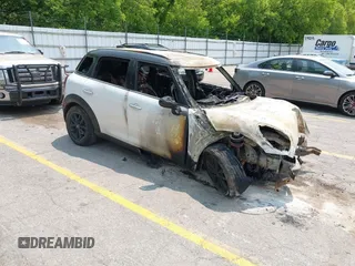 2014 MINI Countryman with VIN WMWZB3C5XEWR42262, listed as a IAAI auction lot 42391574 with Not provided miles and . Bid and sale history available at DreamBid. Image 1.