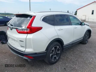 2018 Honda CR-V Touring with VIN 2HKRW2H91JH665241, listed as a IAAI auction lot 42638694 with 62,066 mi miles and . Bid and sale history available at DreamBid. Image 4.