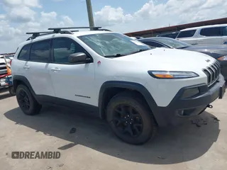 2014 Jeep Cherokee Trailhawk with VIN 1C4PJMBS5EW231448, listed as a IAAI auction lot 42632143 with 97,461 mi miles and . Bid and sale history available at DreamBid. Image 1.