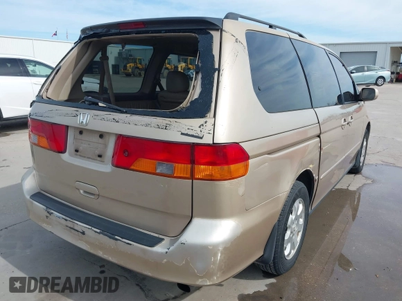 2002 Honda Odyssey EX-L z VIN 2HKRL18042H567858, wystawiony jako IAAI lot #41686147 z przebiegiem 264 570 mil mil oraz . Historia ofert i sprzedaży dostępna na DreamBid. Obrazek 6.