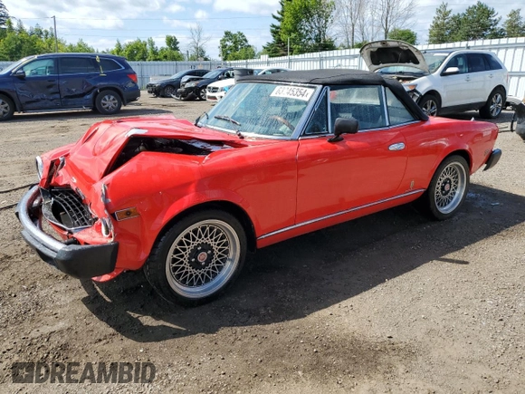 1979 FIAT 124 Spider z VIN 124CS20142625, wystawiony jako Copart lot #63245354 z przebiegiem 41 509 mil mil oraz Czysty tytuł • Clean title. Historia ofert i sprzedaży dostępna na DreamBid. Obrazek 1.