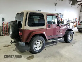 2002 Jeep Wrangler Sahara z VIN 1J4FA59S62P751858, wystawiony jako Copart lot #56638165 z przebiegiem 270 770 mil mil oraz Szkoda całkowita • Salvage title. Historia ofert i sprzedaży dostępna na DreamBid. Obrazek 3.