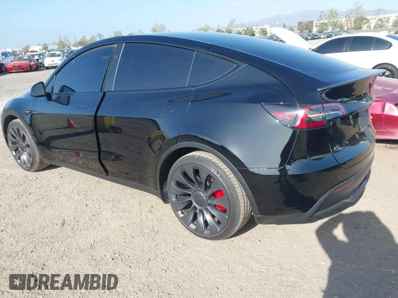 2023 Tesla Model Y Performance with VIN 7SAYGDEF4PF809308, listed as a IAAI auction lot 42056769 with 12,101 mi miles and . Bid and sale history available at DreamBid. Image 2.