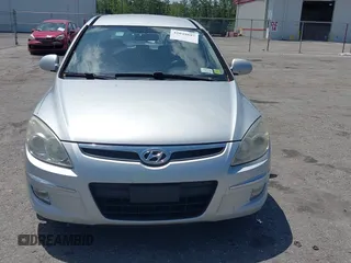 2009 Hyundai Elantra Touring with VIN KMHDC86E99U035163, listed as a IAAI auction lot 42049897 with 123,559 mi miles and . Bid and sale history available at DreamBid. Image 6.