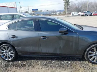 2023 Mazda 3 S Premium with VIN 3MZBPBDM8PM373434, listed as a IAAI auction lot 41234729 with 9,387 mi miles and . Bid and sale history available at DreamBid. Image 13.
