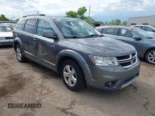 2012 Dodge Journey SXT z VIN 3C4PDDBG2CT208389, wystawiony jako IAAI lot #42309764 z przebiegiem 203 671 mil mil oraz . Historia ofert i sprzedaży dostępna na DreamBid. Obrazek 1.
