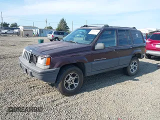 1996 Jeep Grand Cherokee Laredo with VIN 1J4GZ58S2TC262980, listed as a IAAI auction lot 41949514 with 269,674 mi miles and . Bid and sale history available at DreamBid. Image 2.