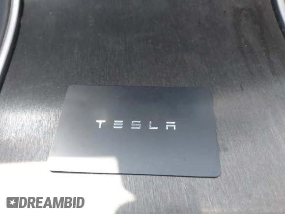 2020 Tesla Model 3 Standard Range Plus with VIN 5YJ3E1EA1LF659765, listed as a IAAI auction lot 41834411 with 42,433 mi miles and . Bid and sale history available at carsss.com. Image 11.