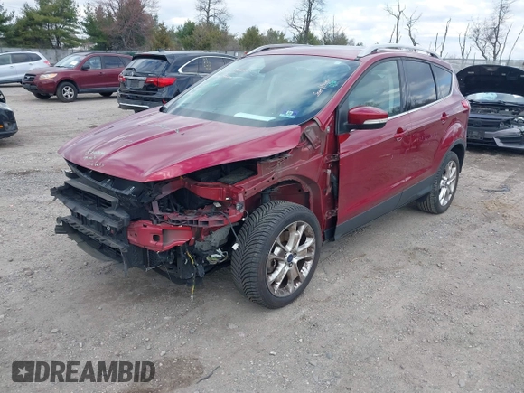 2016 Ford Escape Titanium with VIN 1FMCU9JX2GUA89716, listed as a IAAI auction lot 41899786 with 85,474 mi miles and . Bid and sale history available at DreamBid. Image 2.