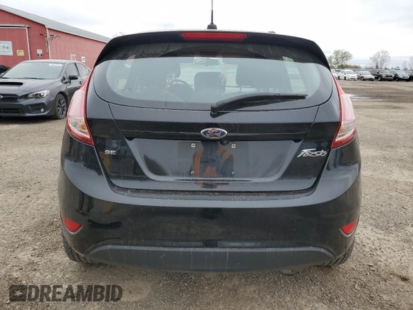 2019 Ford Fiesta SE z VIN 3FADP4EJ8KM124903, wystawiony jako Copart lot #54560125 z przebiegiem 86 616 mil mil oraz Szkoda całkowita • Salvage title. Historia ofert i sprzedaży dostępna na DreamBid. Obrazek 6.